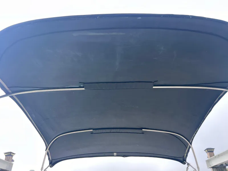 Slide: The Image of Bimini top of 2007 Sea Ray 240 Sundeck with 2023 motor. - 32