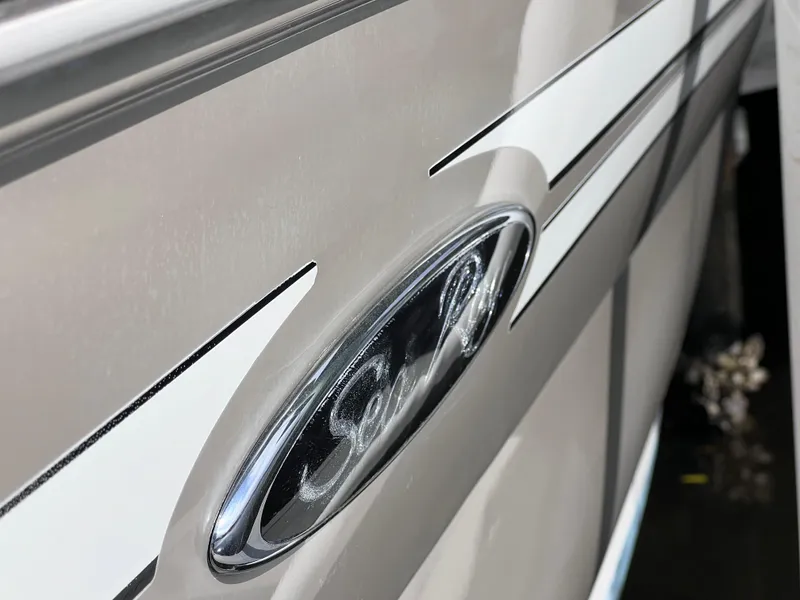Slide: The Image of Close-up of 2007 Sea Ray 240 Sundeck with 2023 motor, showing logo and sleek design. - 34