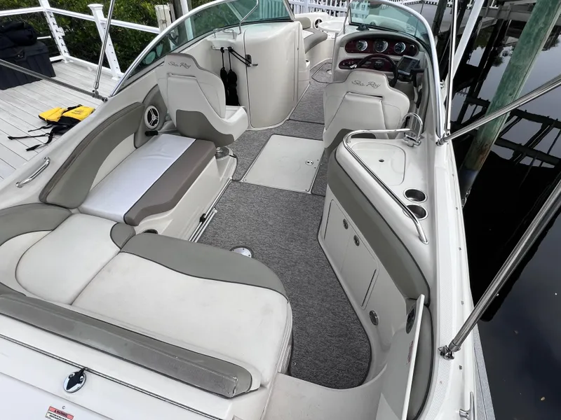 Slide: The Image of 2007 Sea Ray 240 Sundeck with 2023 motor, spacious seating, and modern interior. - 4