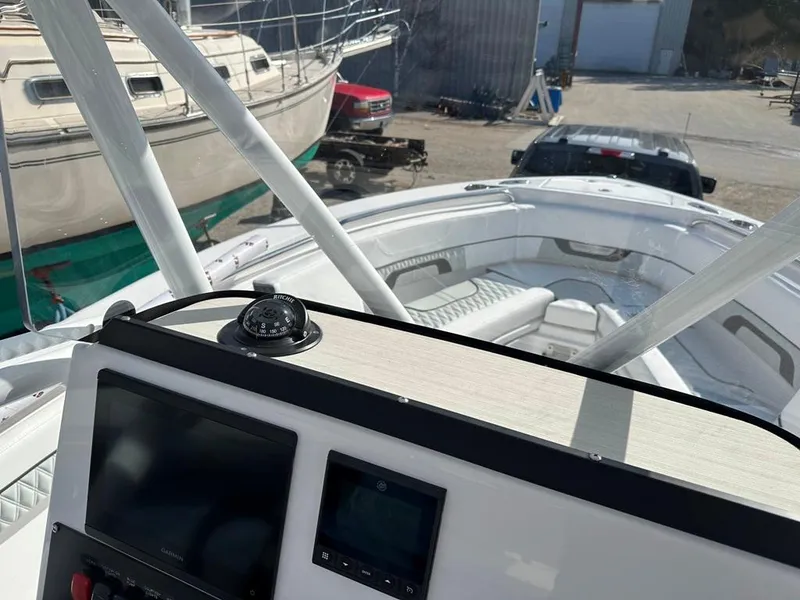 Slide: The Image of 2024 Blackfin 222CC center console boat interior with navigation equipment. - 21