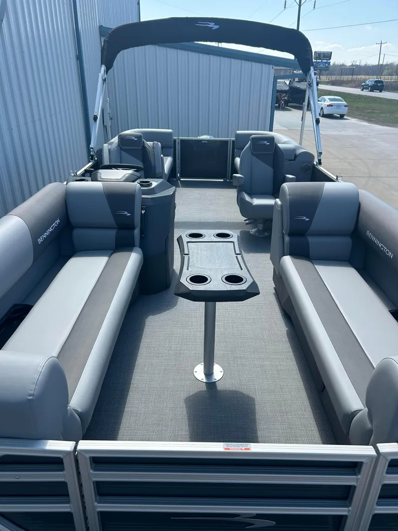 Slide: The Image of 2024 Bennington 22 SVSR pontoon boat with spacious seating and cup holders. - 5
