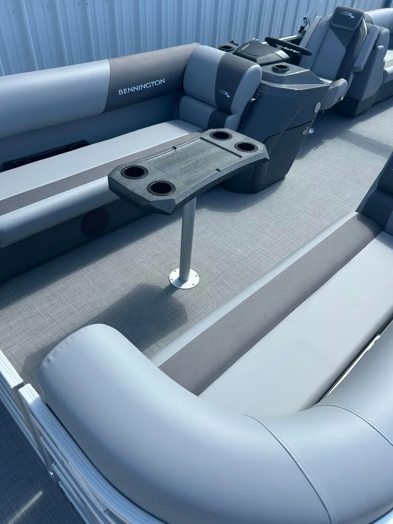 Slide: The Image of 2024 Bennington 22 SVSR pontoon boat interior with seating and table. - 6