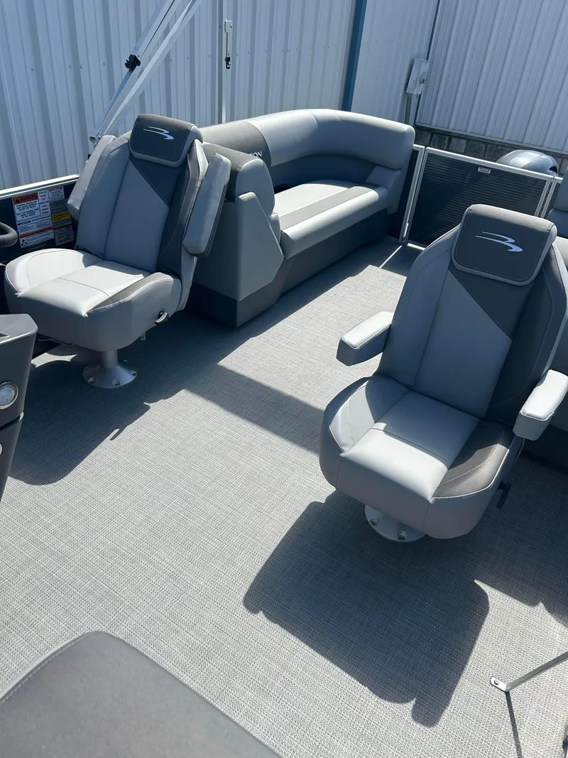 Slide: The Image of 2024 Bennington 22 SVSR pontoon boat interior with gray seating. - 7