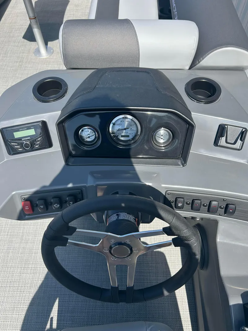 Slide: The Image of 2024 Bennington 22 SVSR boat dashboard with steering wheel and control panel. - 9