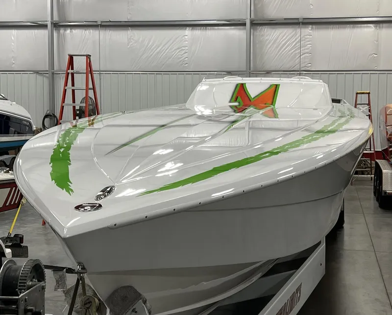 Slide: The Image of 2015 Outerlimits SL-50 speedboat in a storage facility. - 10