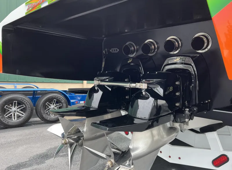 Slide: The Image of 2015 Outerlimits SL-50 boat stern with dual propellers and exhaust ports. - 20