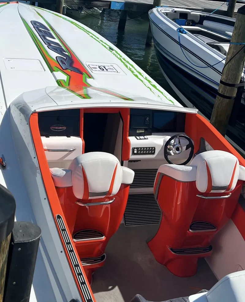 Slide: The Image of 2015 Outerlimits SL-50 speedboat with vibrant interior and advanced dashboard. - 23