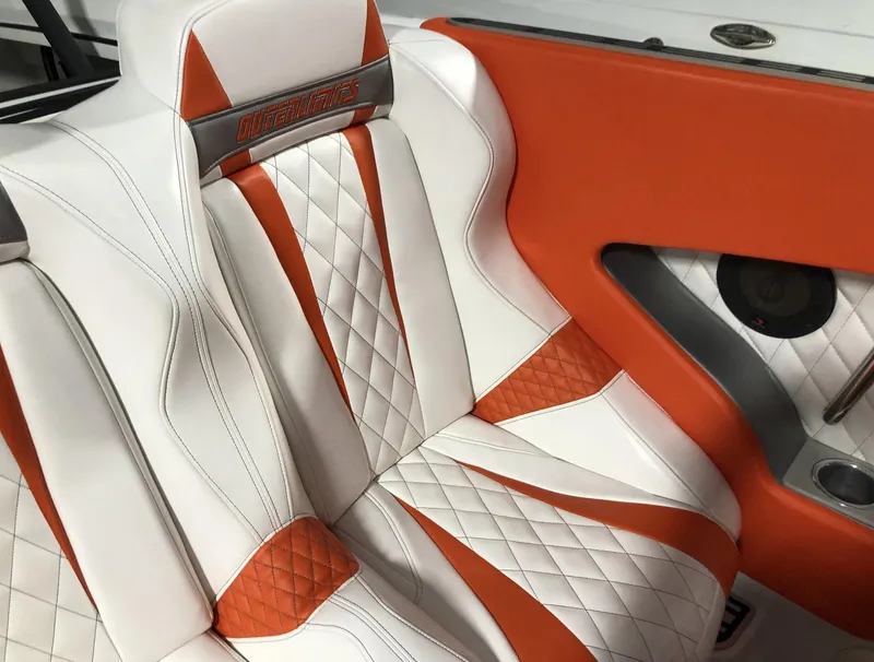Slide: The Image of 2015 Outerlimits SL-50 boat interior with white and orange diamond-stitched leather seats. - 24