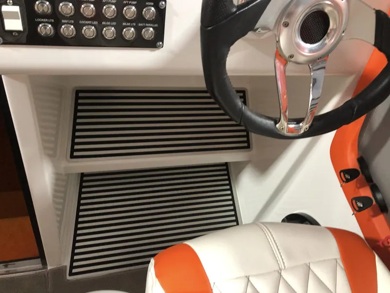 Slide: The Image of 2015 Outerlimits SL-50 boat cockpit with steering wheel and control panel. - 28