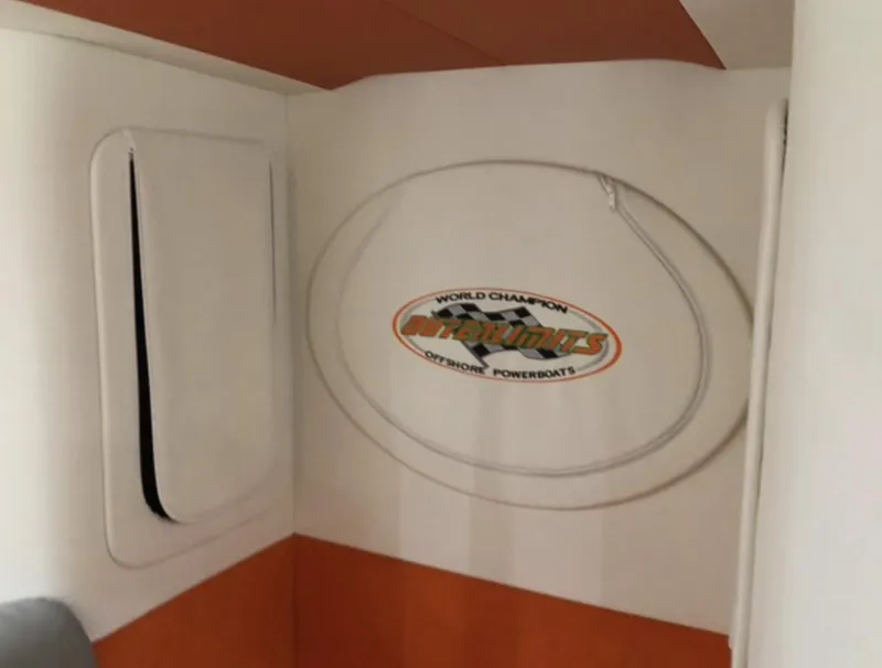 Slide: The Image of 2015 Outerlimits SL-50 interior with logo, white and orange design. - 32