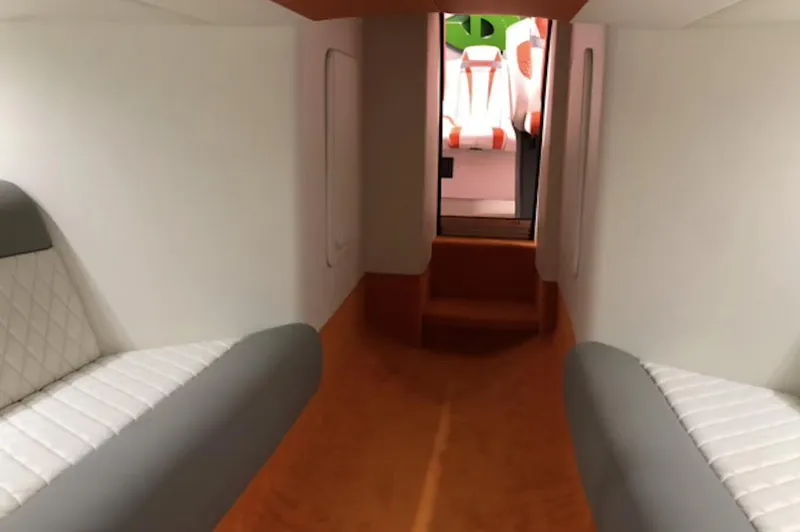 Slide: The Image of Interior cabin of 2015 Outerlimits SL-50 boat with white and gray seating. - 36