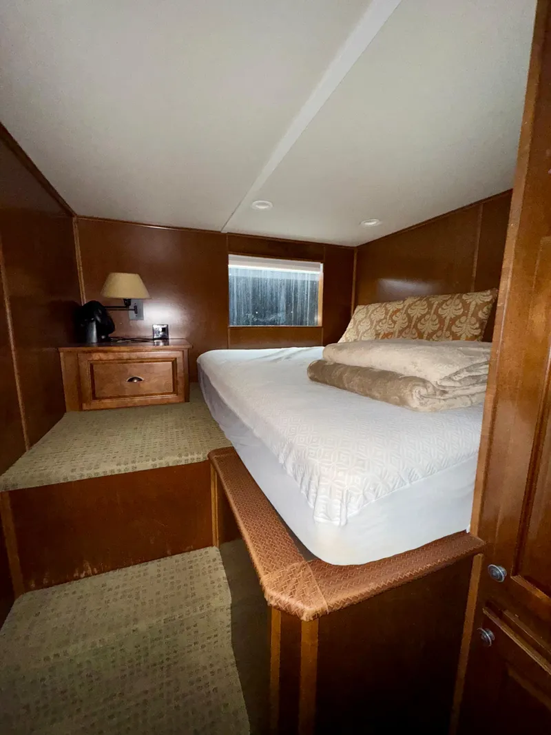 Slide: The Image of Luxurious wooden interior of 2011 Bravada Dreamweaver Share #14 houseboat bedroom. - 7
