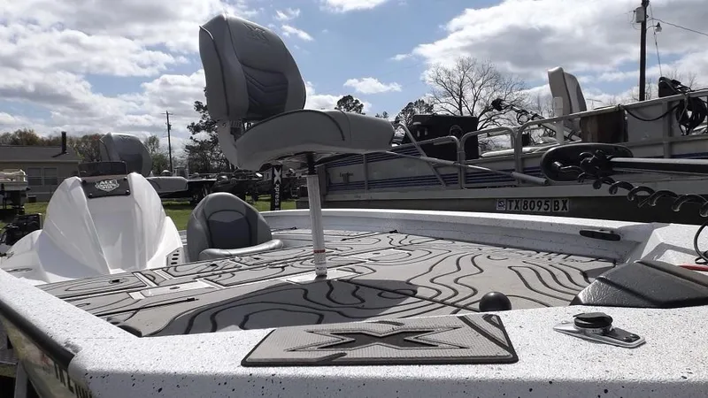 Slide: The Image of 2021 Xpress XP7 boat with elevated seating and modern deck design. - 10