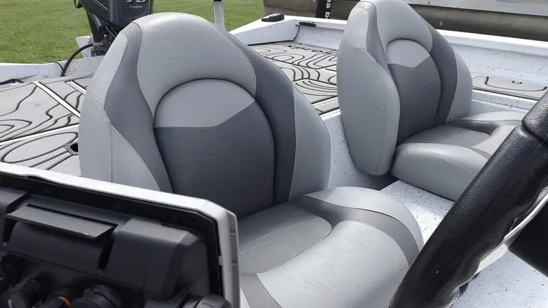 Slide: The Image of 2021 Xpress XP7 boat interior with gray and black seats. - 16