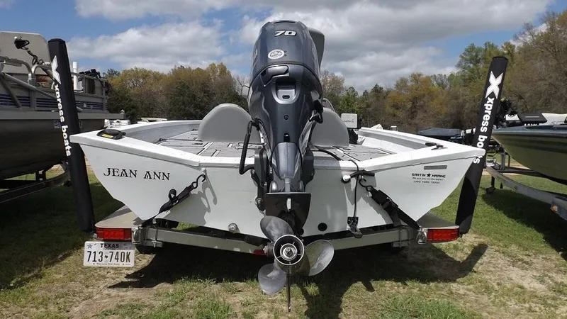 Slide: The Image of 2021 Xpress XP7 boat with motor, rear view, on trailer, named Jean Ann. - 3