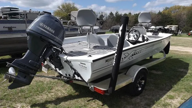 Slide: The Image of 2021 Xpress XP7 boat with Yamaha outboard motor on trailer. - 4