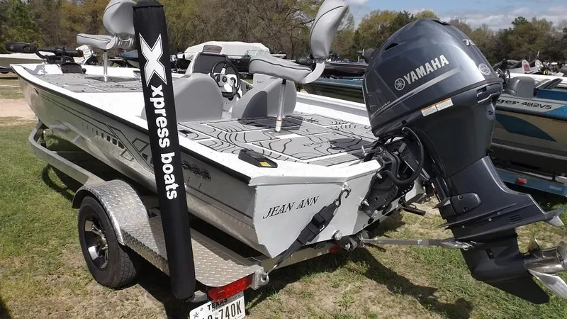 Slide: The Image of 2021 Xpress XP7 boat with Yamaha outboard motor on a trailer. - 5