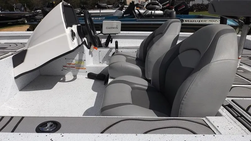 Slide: The Image of 2021 Xpress XP7 boat interior with gray seats and Garmin electronics. - 6