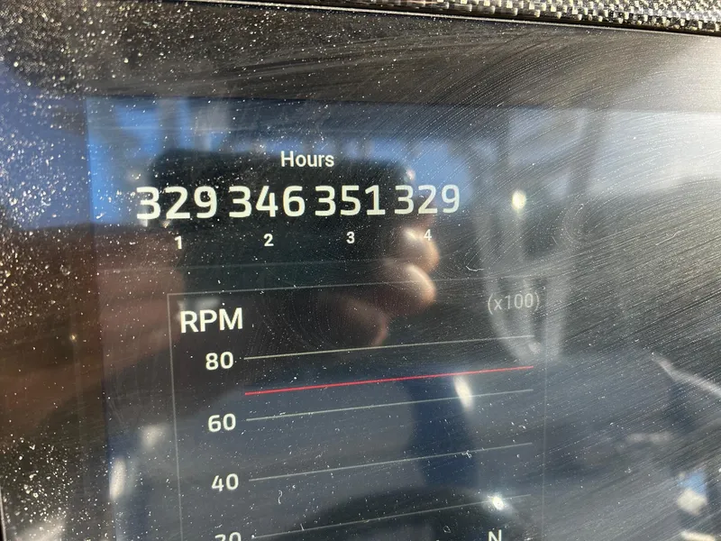 Slide: The Image of Close-up of Nor-Tech 392 Superfish 2022 boat's digital hour meter and RPM display. - 10