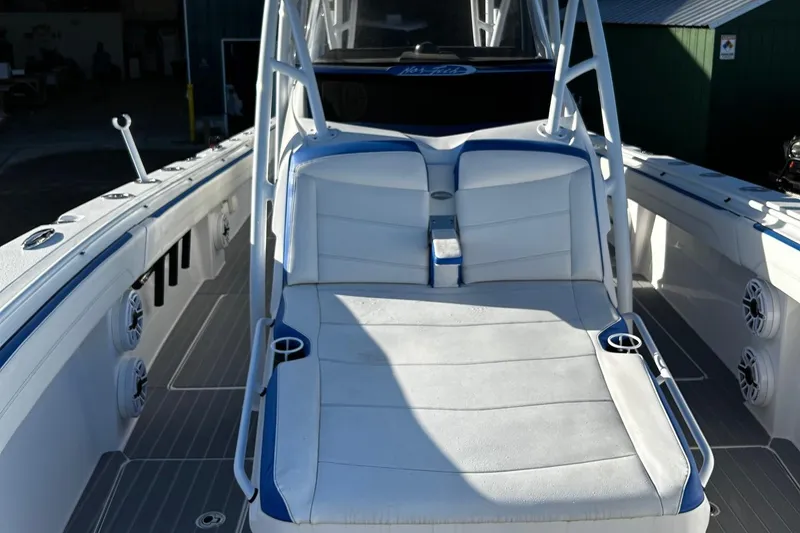 Slide: The Image of 2022 Nor-Tech 392 Superfish boat with white and blue seating. - 12