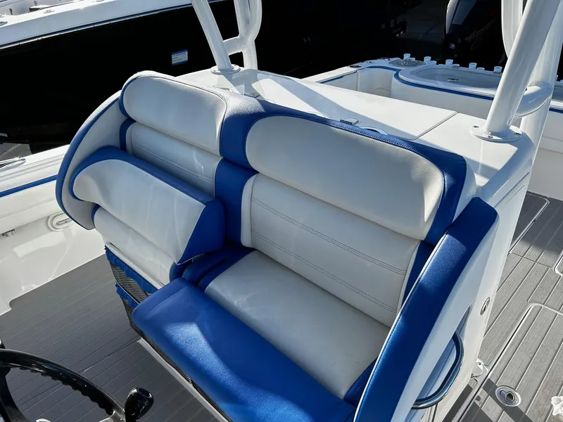 Slide: The Image of 2022 Nor-Tech 392 Superfish boat with blue and white cushioned seating. - 13