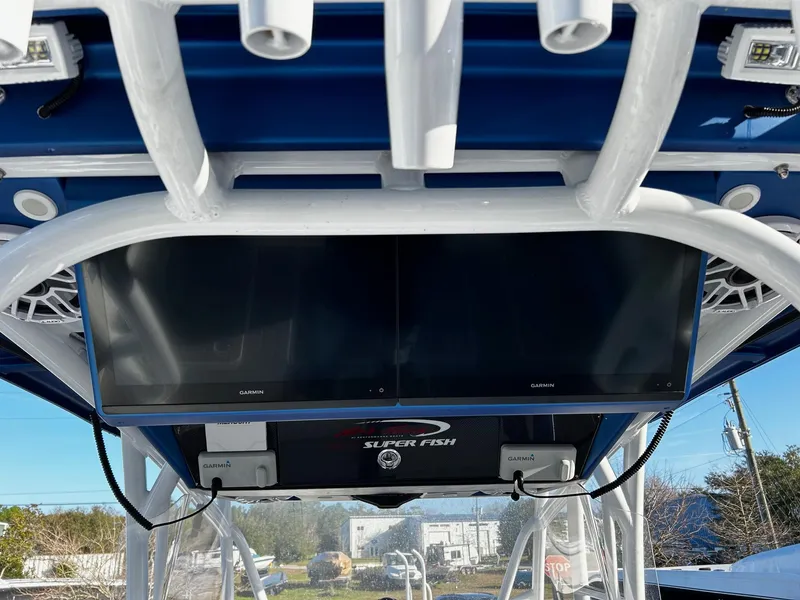 Slide: The Image of 2022 Nor-Tech 392 Superfish boat with dual Garmin displays and Superfish logo. - 15