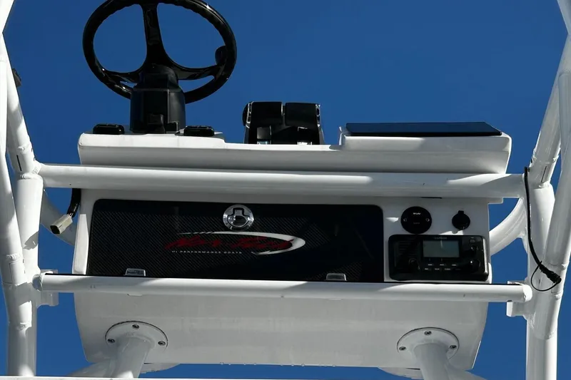 Slide: The Image of 2022 Nor-Tech 392 Superfish boat helm station with steering wheel and controls. - 19
