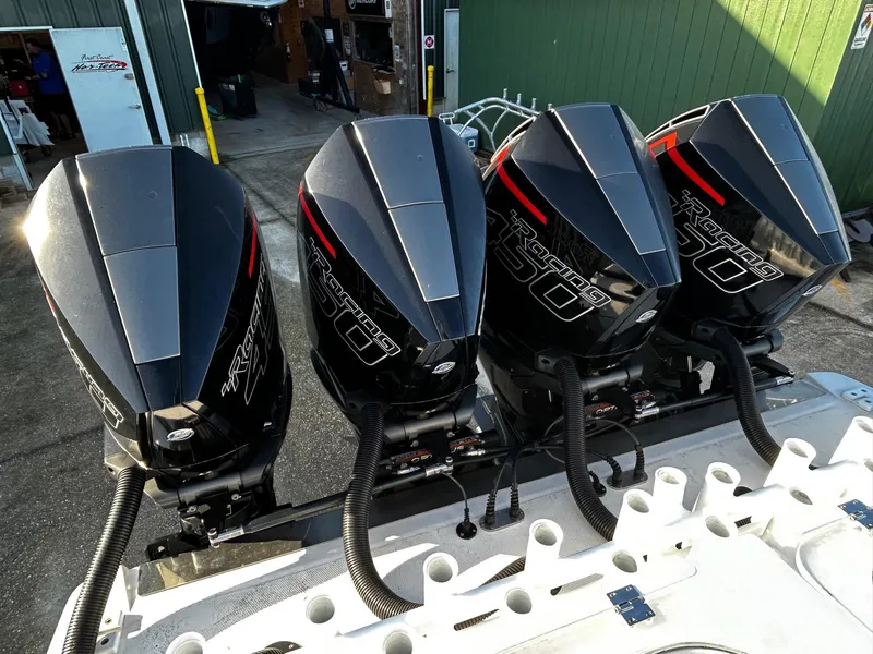 Slide: The Image of Four powerful outboard motors on a 2022 Nor-Tech 392 Superfish boat. - 8