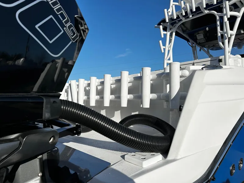 Slide: The Image of 2022 Nor-Tech 392 Superfish boat, close-up of engine and rod holders. - 9