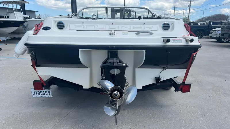 Slide: The Image of 2012 Bayliner 175 Bowrider boat rear view with outboard motor. - 10