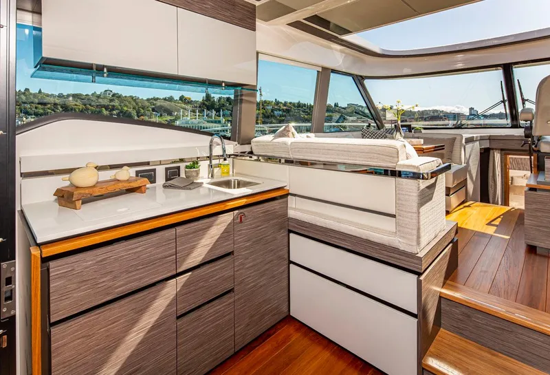 Slide: The Image of Modern kitchen interior of 2020 Tiara Yachts 49 COUPE with sleek cabinetry and scenic windows. - 11
