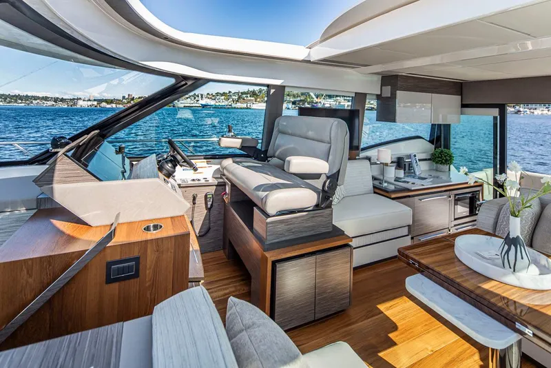 Slide: The Image of Luxurious interior of 2020 Tiara Yachts 49 COUPE with modern furnishings and scenic water view. - 17