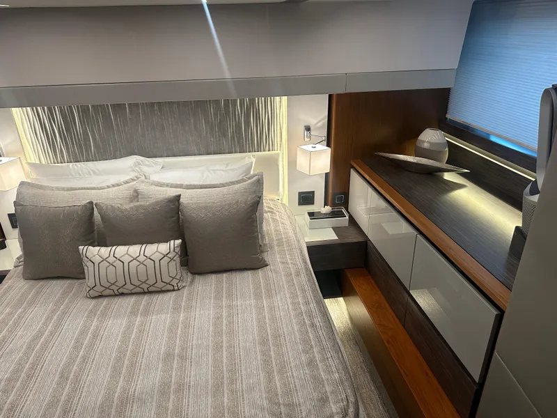 Slide: The Image of Luxurious bedroom interior of 2020 Tiara Yachts 49 COUPE with modern decor and ambient lighting. - 19