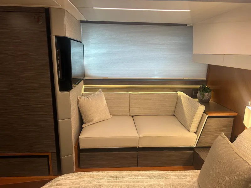 Slide: The Image of Interior of 2020 Tiara Yachts 49 COUPE with cozy seating area and modern design. - 20
