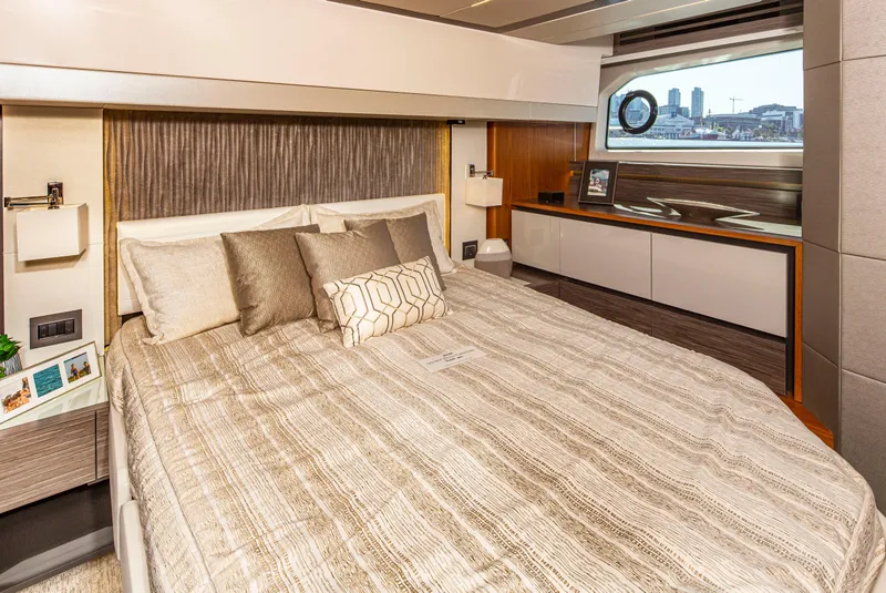 Slide: The Image of Luxurious bedroom interior of 2020 Tiara Yachts 49 COUPE with modern decor and large window. - 22