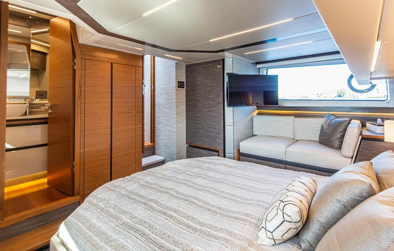 Slide: The Image of Luxurious interior of 2020 Tiara Yachts 49 COUPE with modern bedroom and seating area. - 23