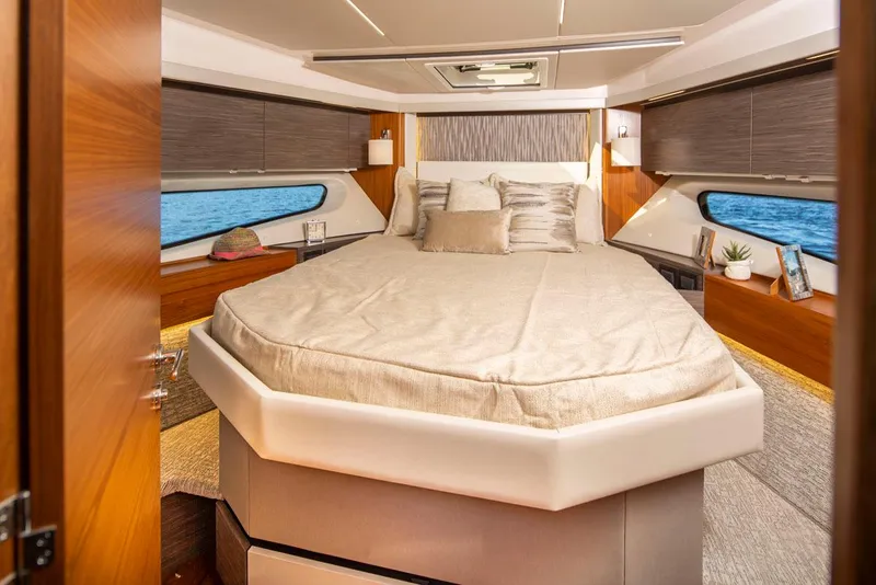 Slide: The Image of Luxurious bedroom interior of 2020 Tiara Yachts 49 COUPE with ocean view windows. - 28
