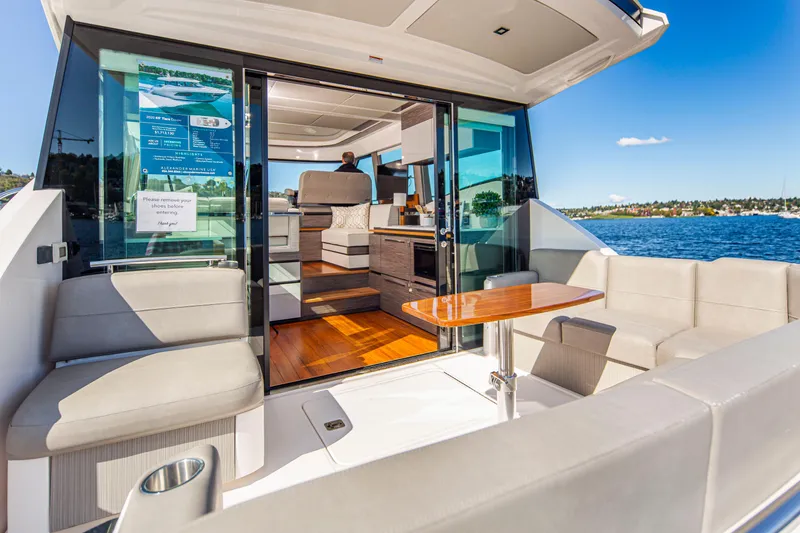 Slide: The Image of 2020 Tiara Yachts 49 COUPE, luxurious interior with lake view. - 3
