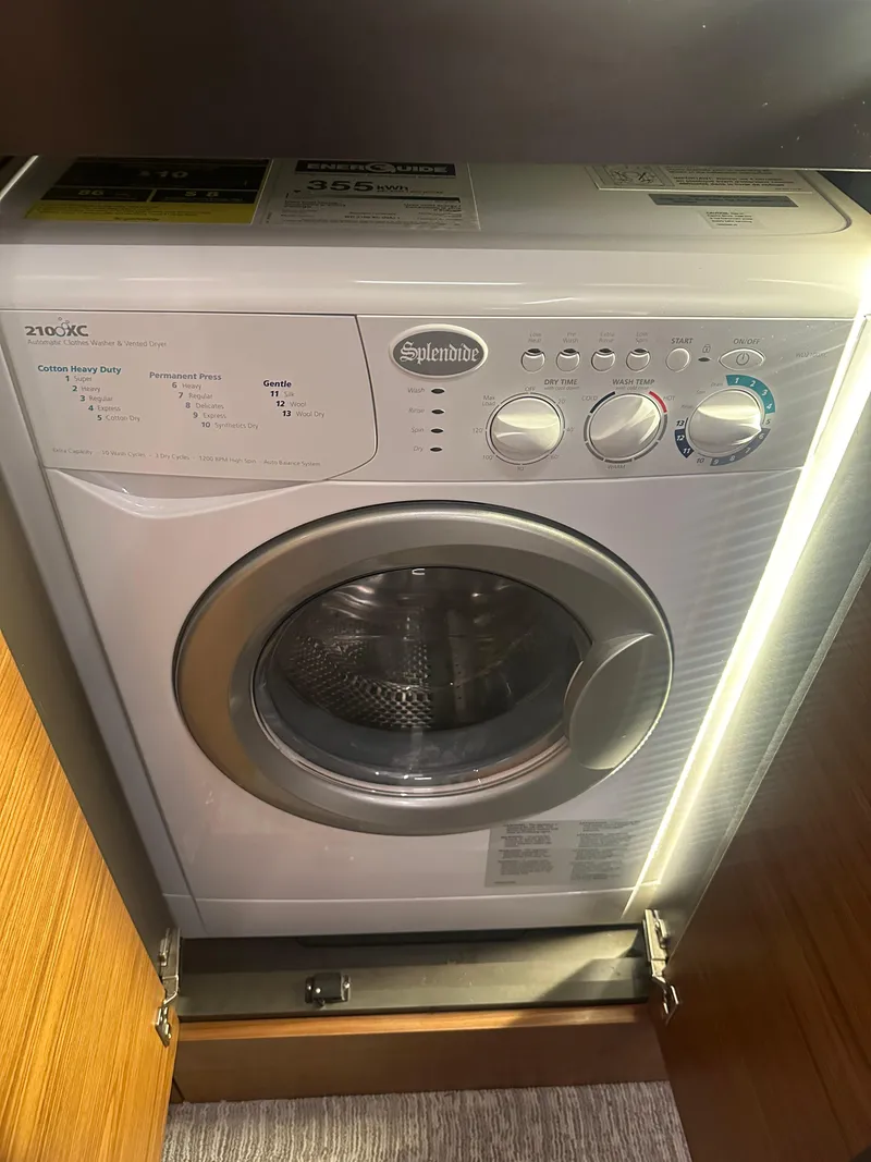 Slide: The Image of Compact washing machine in the 2020 Tiara Yachts 49 COUPE. - 33