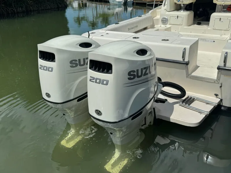 Slide: The Image of 2002 Seamaster 2800 Walkaround with twin Suzuki 200 outboard engines. - 10