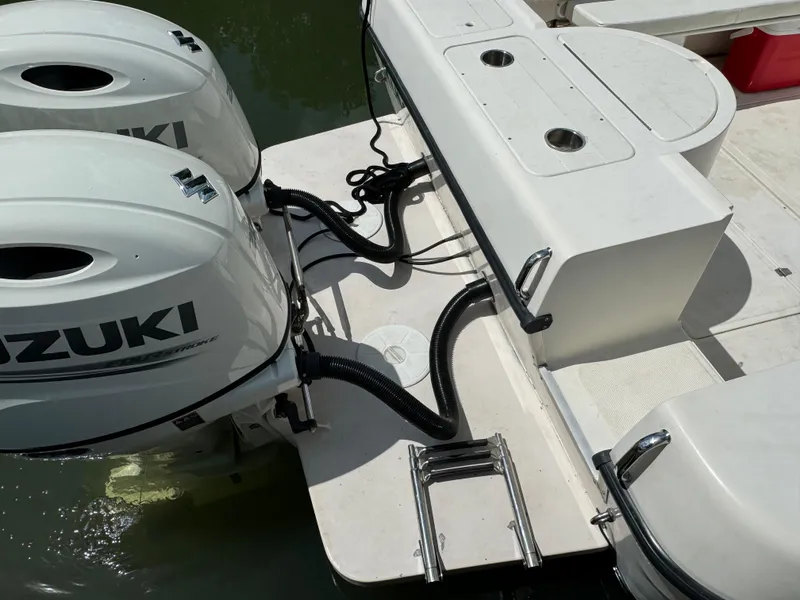 Slide: The Image of 2002 Seamaster 2800 Walkaround with twin Suzuki outboard motors. - 13