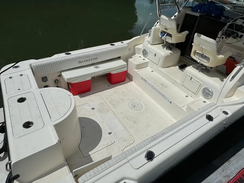 Slide: The Image of 2002 Seamaster 2800 Walkaround boat interior with seating and storage compartments. - 16