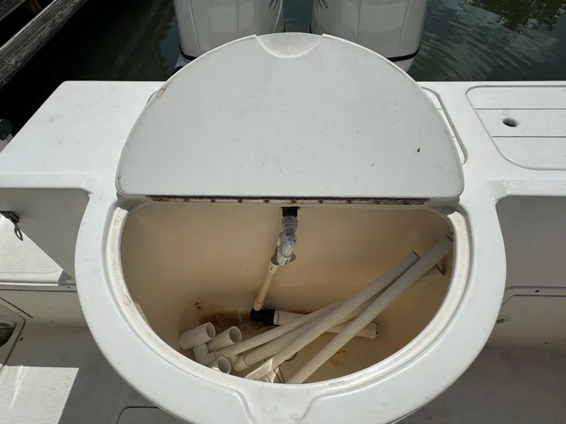 Slide: The Image of Open storage compartment on a 2002 Seamaster 2800 Walkaround boat. - 17