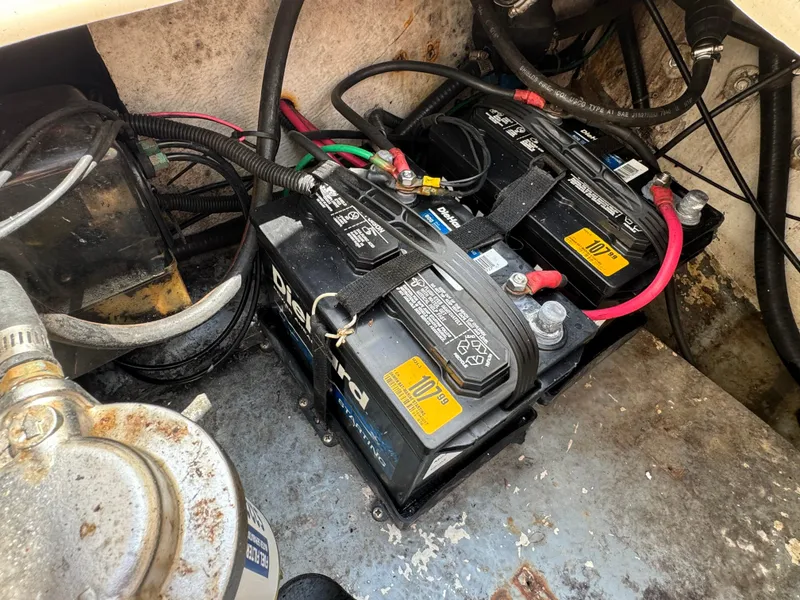 Slide: The Image of Batteries in the engine compartment of a 2002 Seamaster 2800 Walkaround boat. - 20