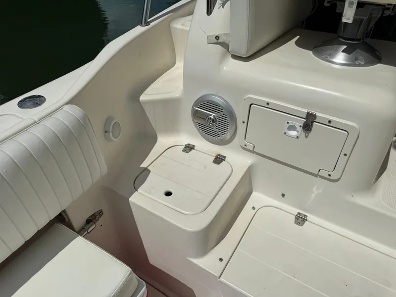 Slide: The Image of 2002 Seamaster 2800 Walkaround boat interior with storage compartments and seating. - 22