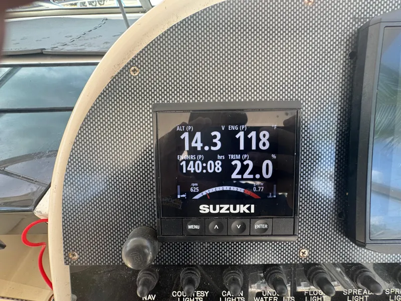 Slide: The Image of Suzuki engine display on 2002 Seamaster 2800 Walkaround boat dashboard. - 28