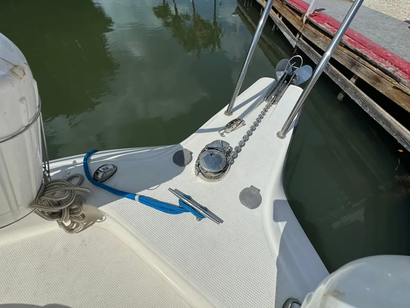 Slide: The Image of Bow of 2002 Seamaster 2800 Walkaround boat with anchor and mooring lines. - 38