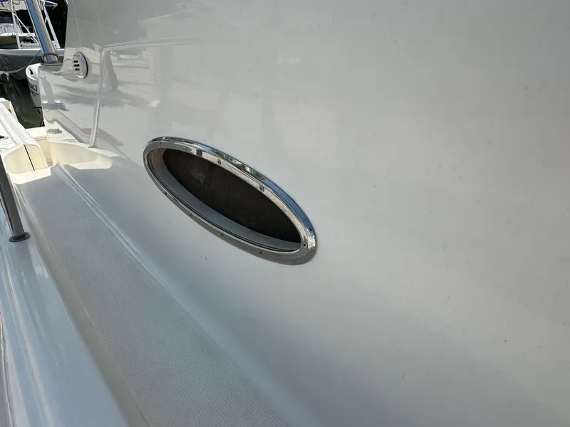 Slide: The Image of Close-up of a 2002 Seamaster 2800 Walkaround boat's side vent. - 40
