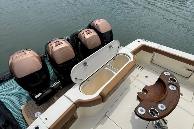 Slide: The Image of 2020 Scout 420 LXF boat with four outboard engines and fishing station. - 42