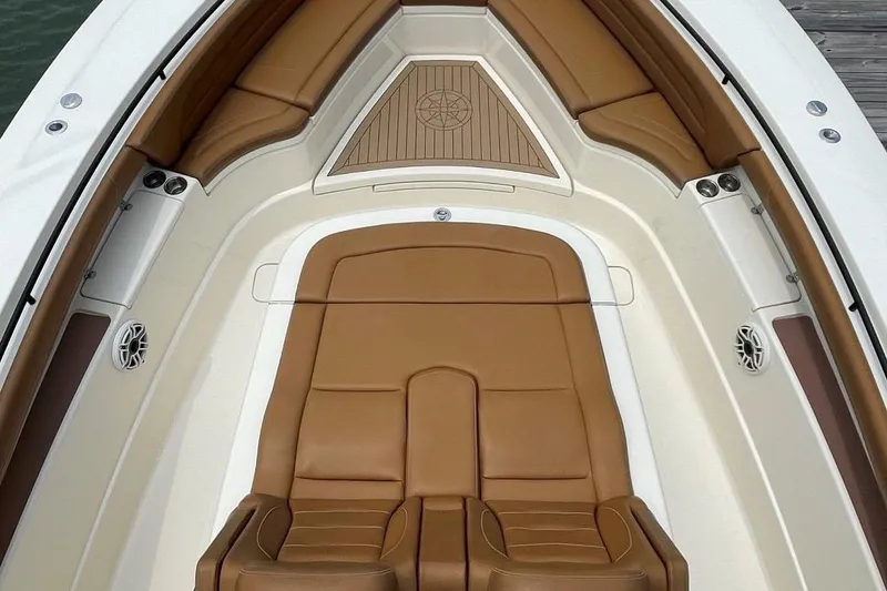 Slide: The Image of 2020 Scout 420 LXF boat with luxurious tan leather seating. - 7